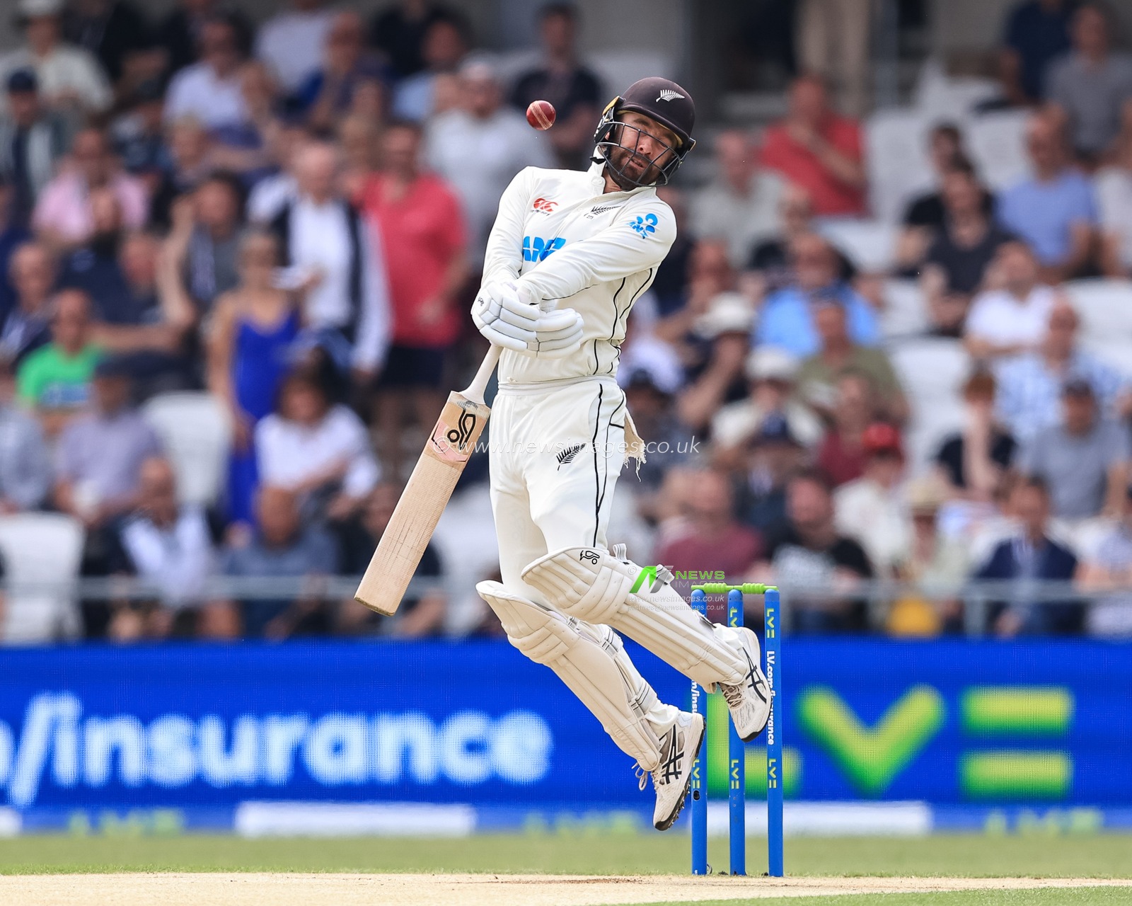 Tom Blundell of New Zealand dodges a bouncer from Jamie Overton of England