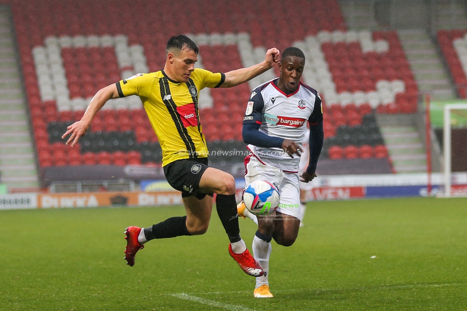 Ryan Fallowfield (2) of Harrogate Town controls the ball