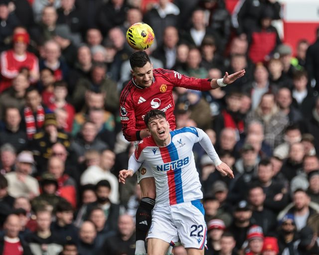Diogo Dalot of Manchester United jumps up to win the high ball from Jorgen Strand Larsen of Crystal Palace during the Premier League match Manchester United vs Crystal Palace at Old Trafford, Manchester, United Kingdom on 01 March 2026

(Photo by Mark Cosgrove/News Images)