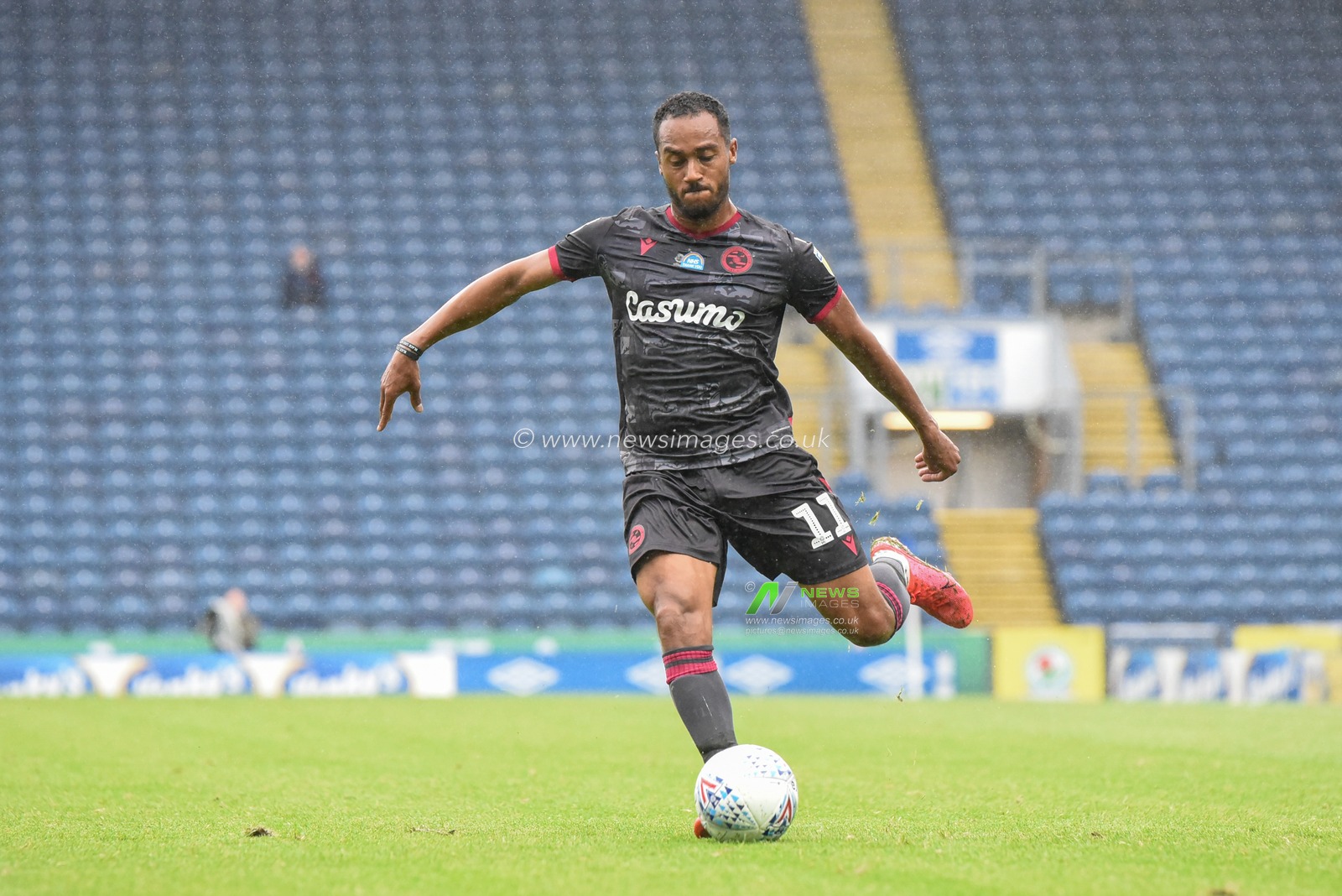 Jordan Obita (11) of Reading crosses the ball