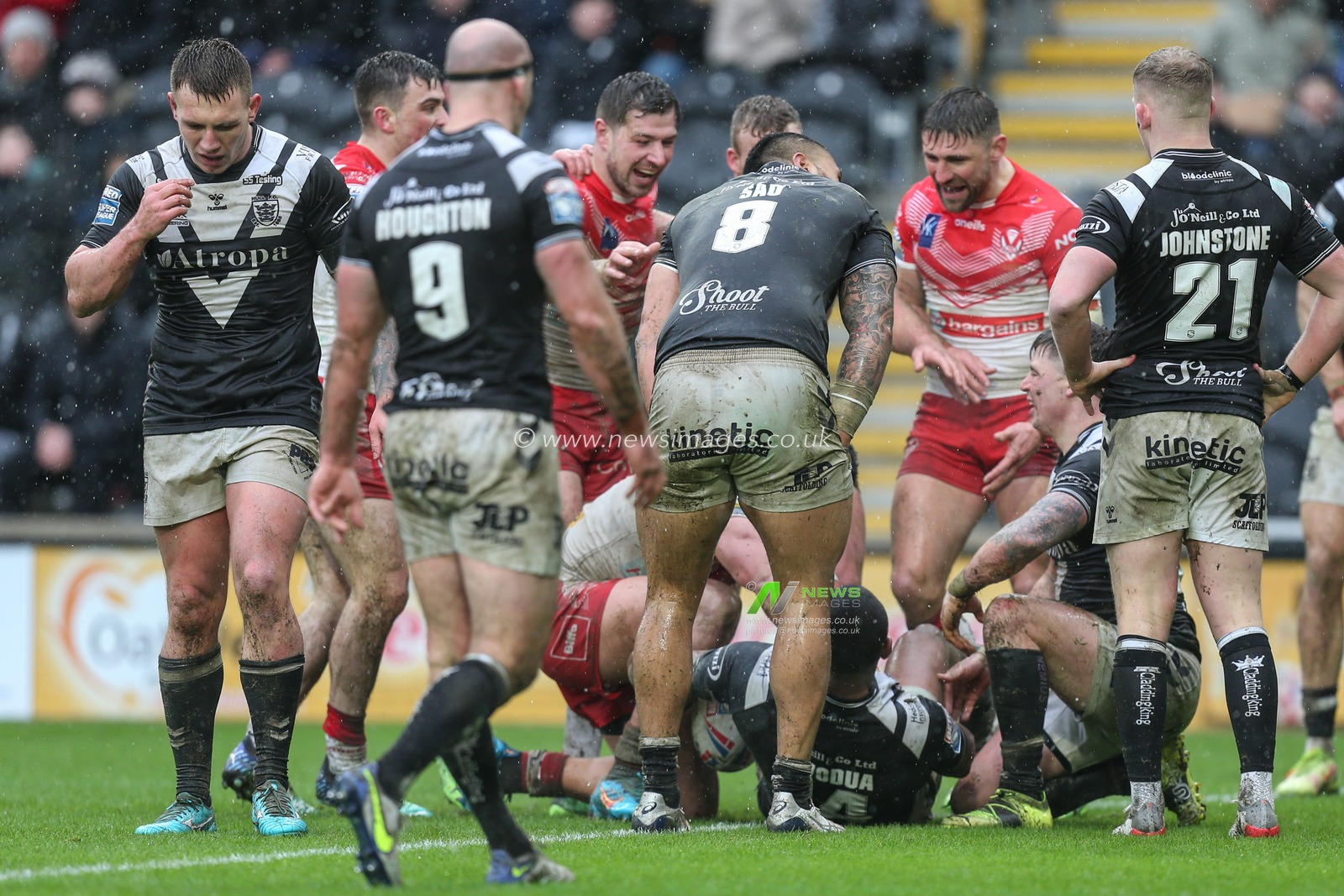 Sione Mataâ€™utia (11) of St Helens begins to celebrate his try