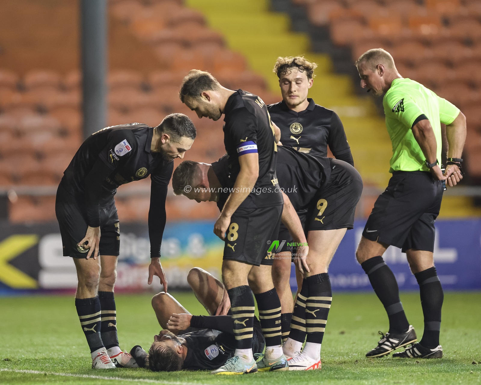 John Mcatee #45 of Barnsleyâ€™s team mates check in on him as he lays injured after scoring to make it 0-1 during the Bristol Street Motors Trophy match Blackpool vs Barnsley at Bloomfield Road, Blackpool, United Kingdom, 5th December 2023

(Photo by Mark Cosgrove/News Images)