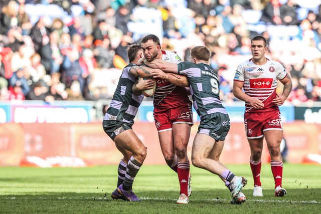 Kaide Ellis of Wigan Warriors is tackled by Zac Woolford of Huddersfield Giants during the Betfred Super League round 6 match Wigan Warriors vs Huddersfield Giants at The Brick Community Stadium, Wigan, United Kingdom on 28 March 2026

(Photo by Alfie Cosgrove/News Images)