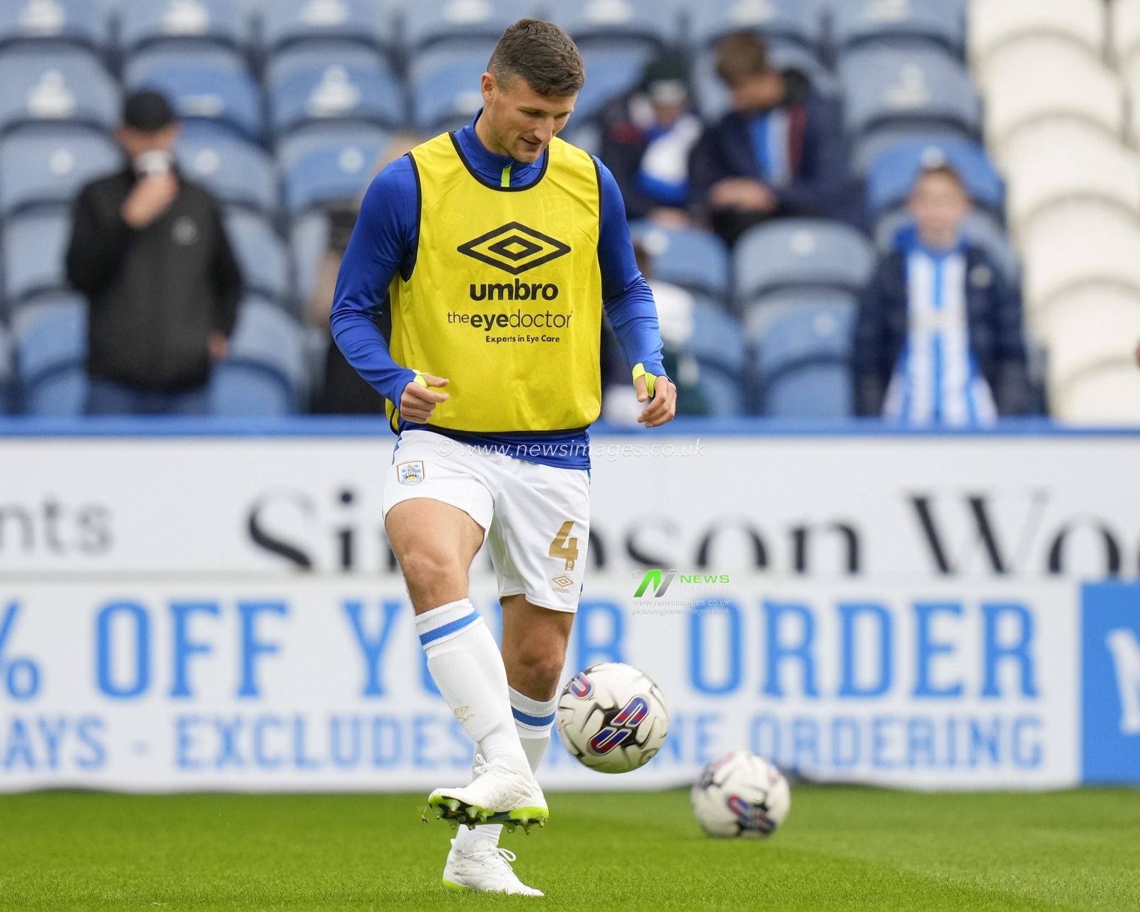 Matty Pearson #4 of Huddersfield Town warms up before the Sky Bet Championship match Huddersfield Town vs Queens Park Rangers at John Smith's Stadium, Huddersfield, United Kingdom, 21st October 2023

(Photo by Steve Flynn/News Images)