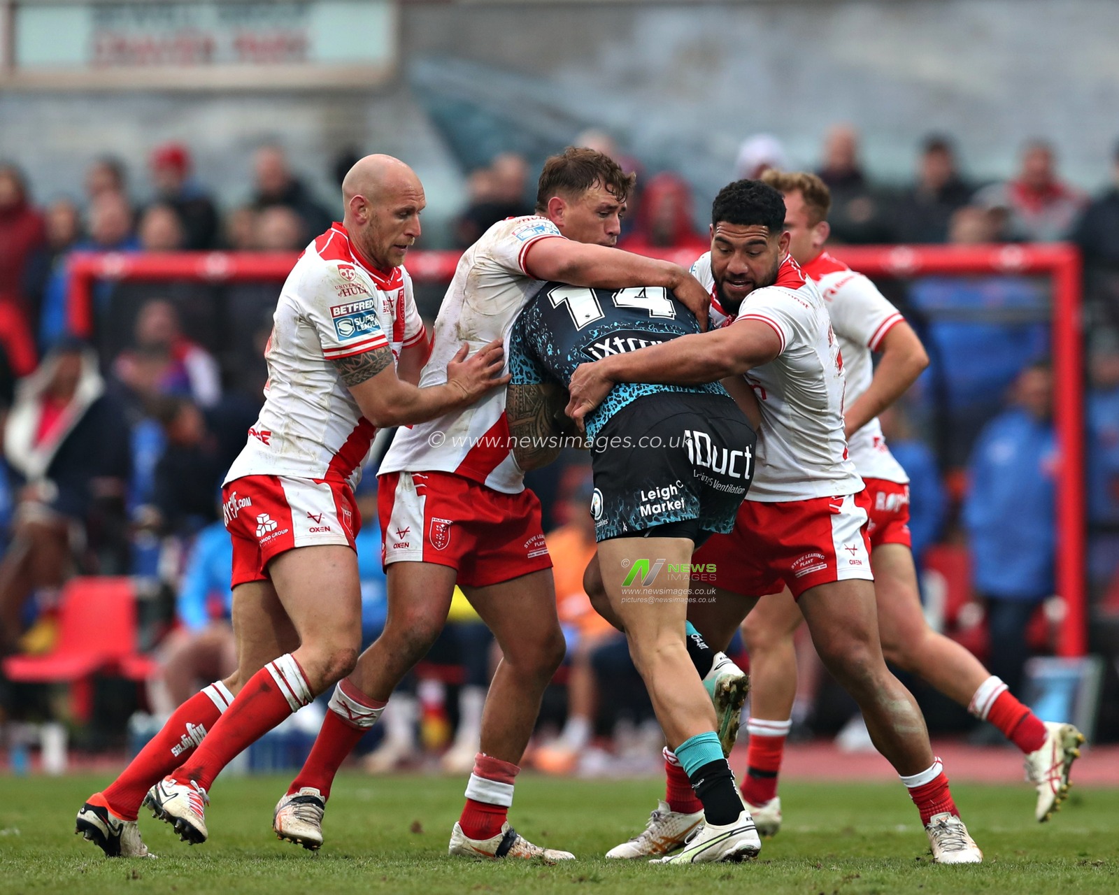 Dean Hadley of Hull KR, Jai Whitbread of Hull KR, and Kelepi Tanginoa of Hull KR tackle Aaron Pene of Leigh Leopards during the Betfred Super League Round 5 match Hull KR vs Leigh Leopards at Sewell Group Craven Park, Kingston upon Hull, United Kingdom, 22nd March 2025

(Photo by Sam Eaden/News Images)