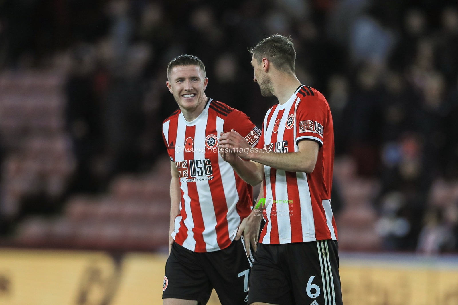 2nd November 2019, Bramall Lane, Sheffield, England; Premier League, Sheffield United v Burnley : John Lundstram (7) of Sheffield United and Chris Basham (6) of Sheffield United celebrate their 3-0 win over Burnley 

Credit: Mark Cosgrove/News Images