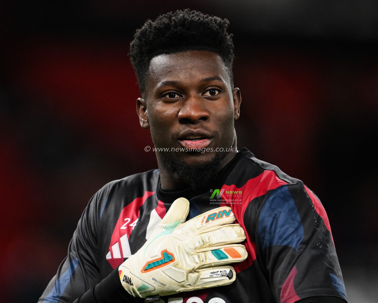 AndrÃ© Onana of Manchester United gestures to the fans during the pre-game warm up ahead of the Premier League match Manchester United vs Newcastle United at Old Trafford, Manchester, United Kingdom, 30th December 2024

(Photo by Craig Thomas/News Images)