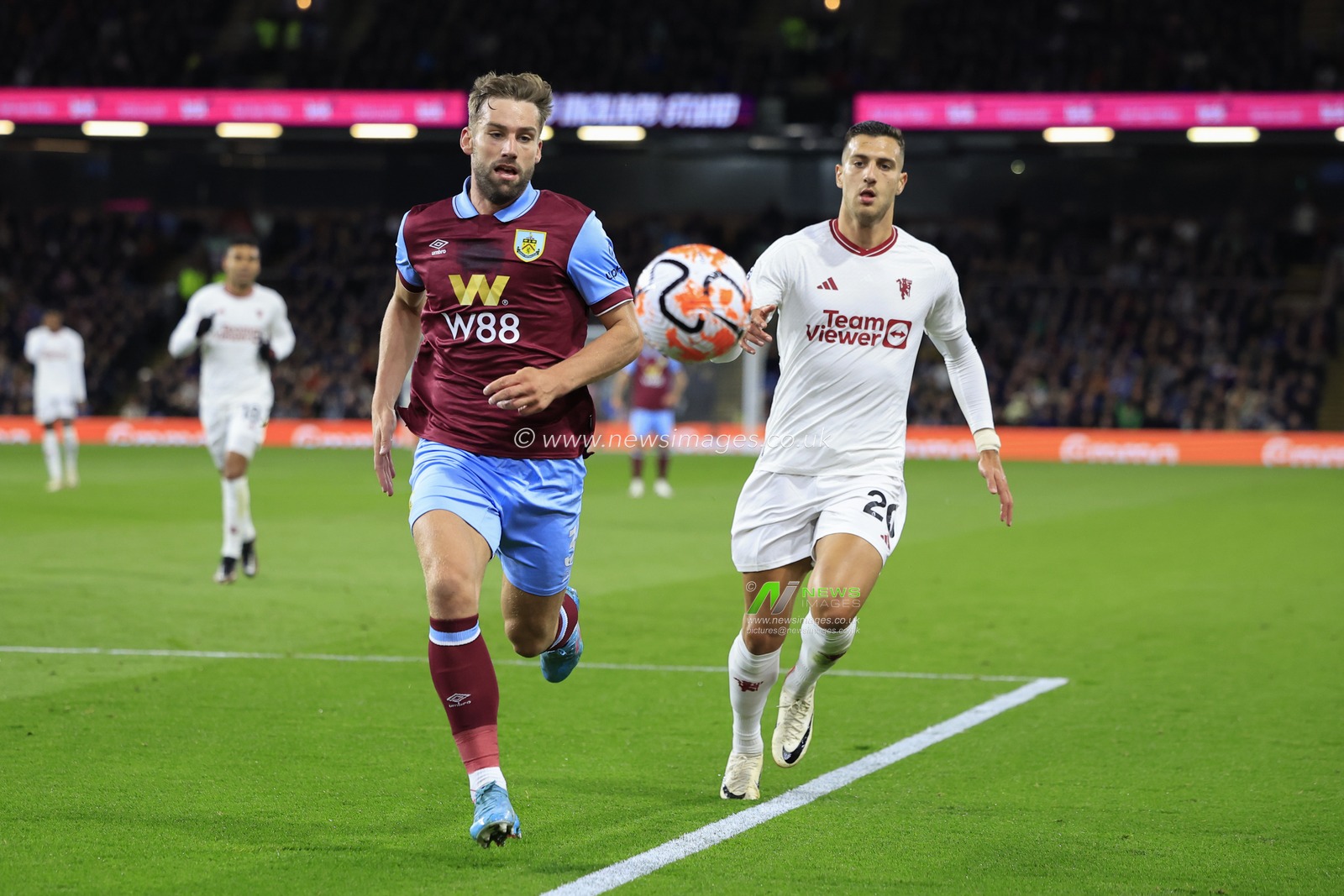 Charlie Taylor #3 of Burnley runs for the ball chased by Diogo Dalot #20 of Manchester United during the Premier League match Burnley vs Manchester United at Turf Moor, Burnley, United Kingdom, 23rd September 2023

(Photo by Conor Molloy/News Images)
