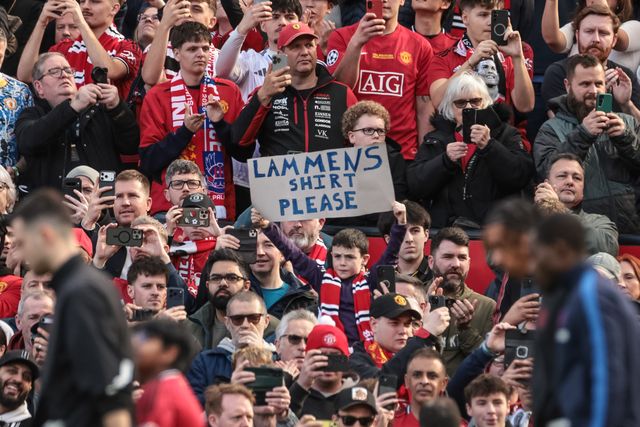 A young United fan holds up a barber for Manchester United goalkeeper Senne Lammens during the Premier League match Manchester United vs Crystal Palace at Old Trafford, Manchester, United Kingdom on 01 March 2026

(Photo by Mark Cosgrove/News Images)