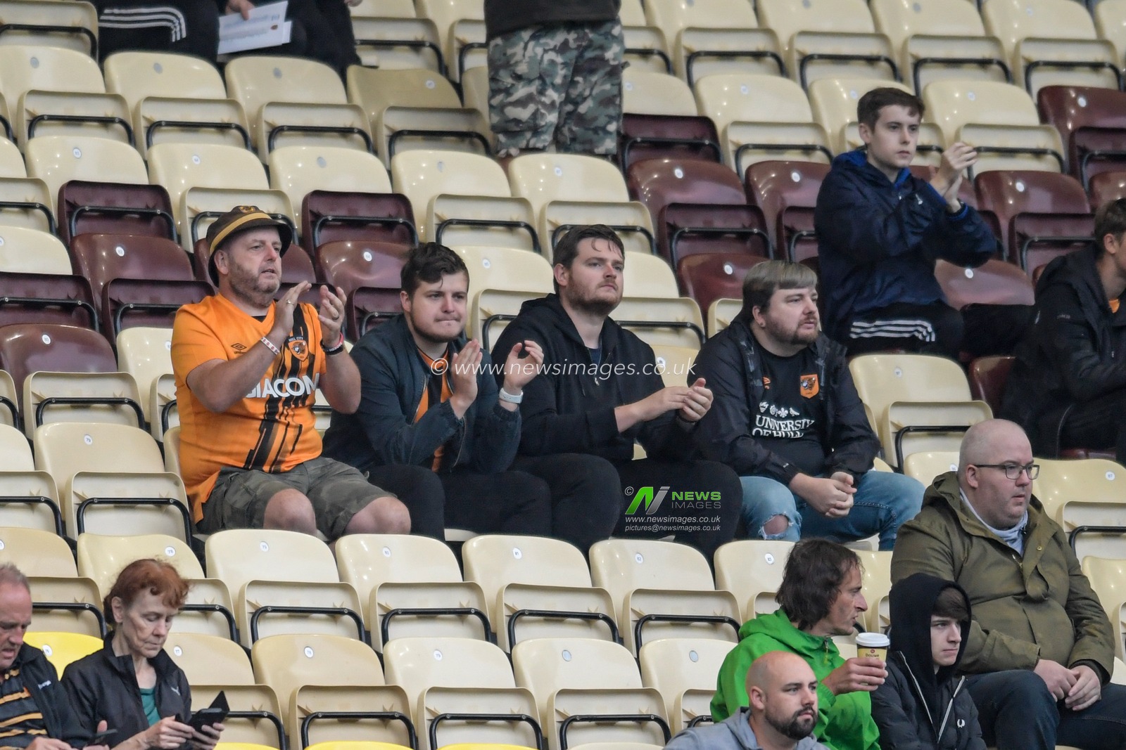 The Hull City fans applaud their team onto the pitch for the warm up
