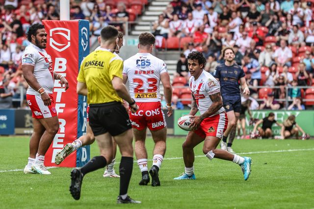 Jake Burns of St. Helens passes the ball to his teammate Jake Burns of St. Helens so he can have the try during the Betfred Super League round 16 match St Helens vs Salford Red Devils at Totally Wicked Stadium, St Helens, United Kingdom, 29th June 2025

(Photo by Alfie Cosgrove/News Images)