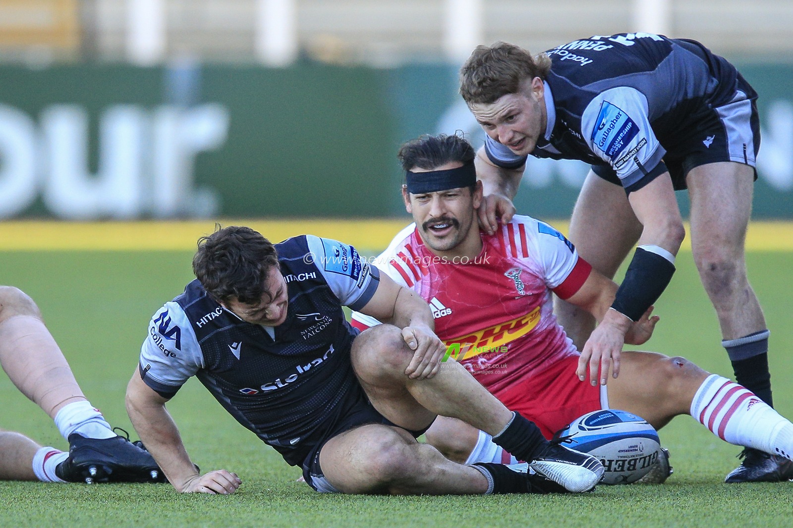 Adam Radwan of Newcastle Falcons clutches his knee as he sustains an injury