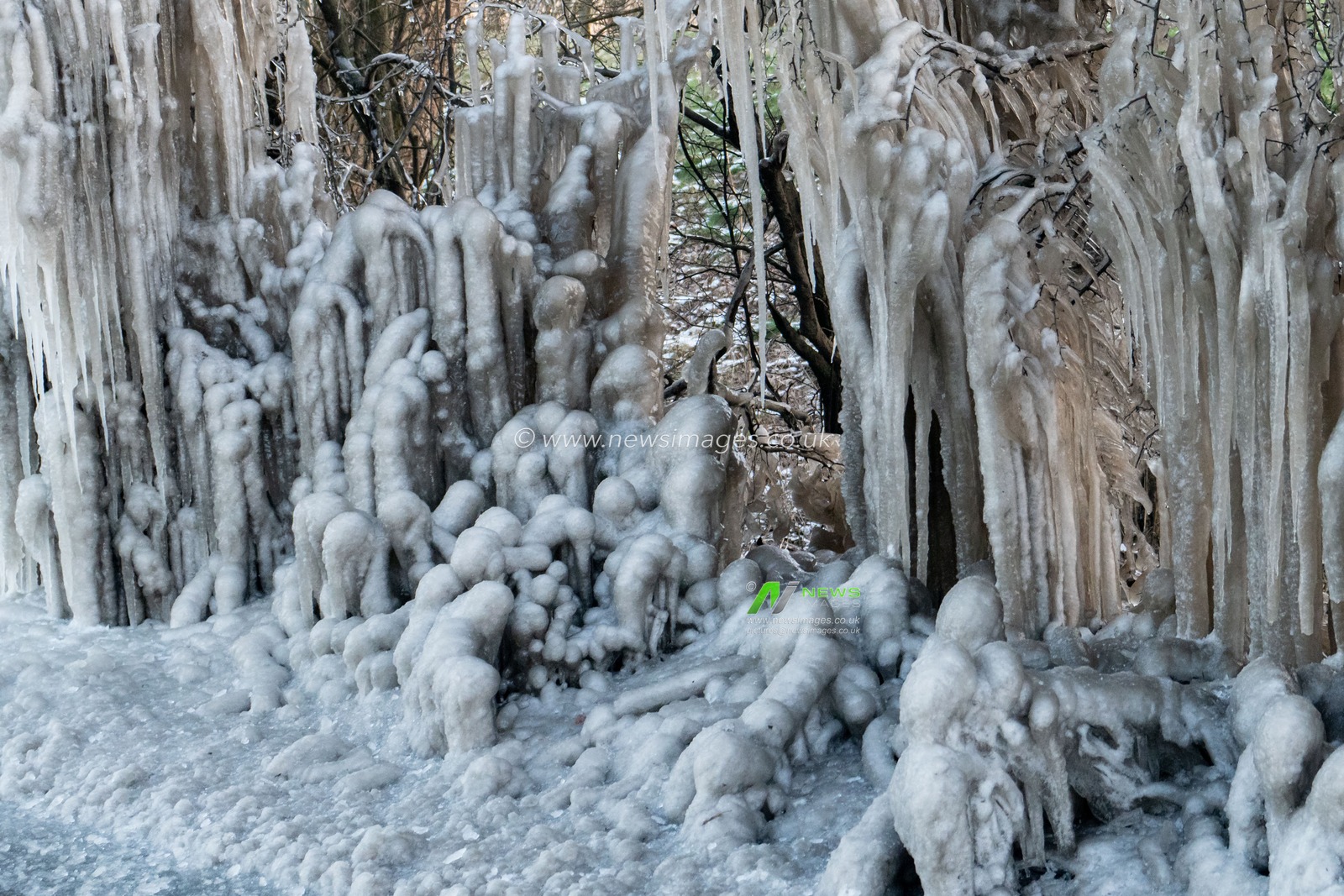 Sub zero conditions in Hertfordshire with side road water has formed these ice formations on the busy A1081 South Mimms road