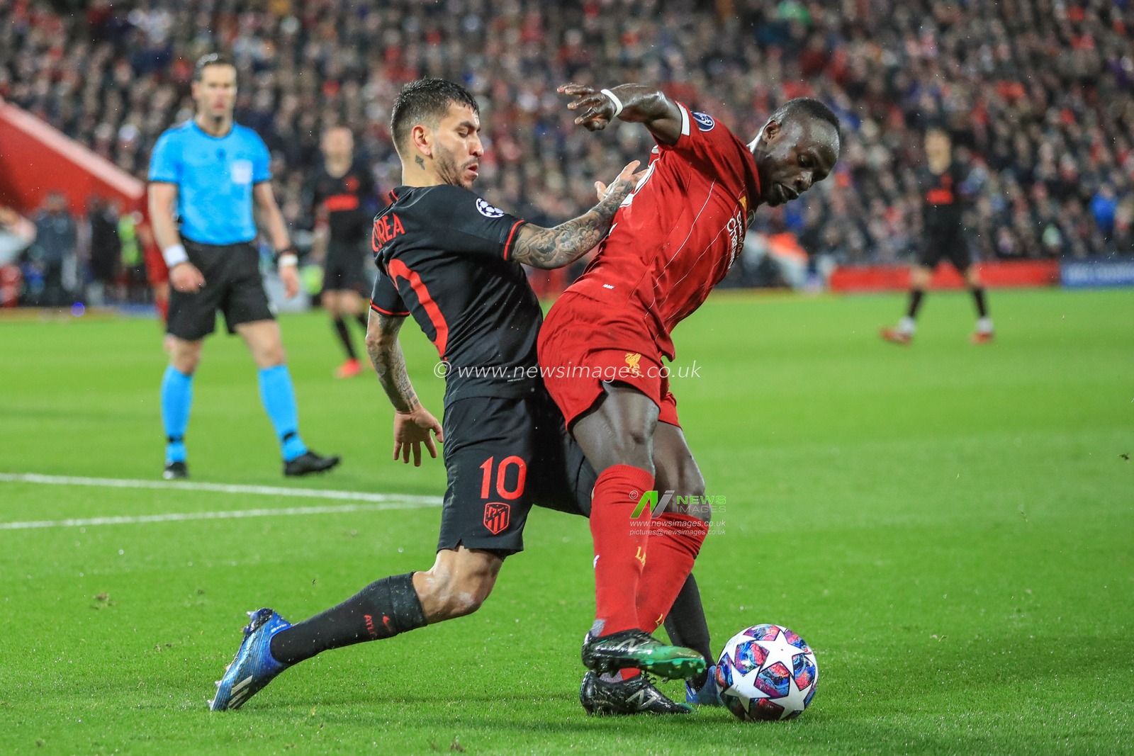 11th March 2020, Anfield, Liverpool, England; UEFA Champions League, Round of 16 Leg 2 of 2, Liverpool v Atletico Madrid : Sadio Mane (10) of Liverpool holds off Ãngel Correa (10) of Atletico Madrid
