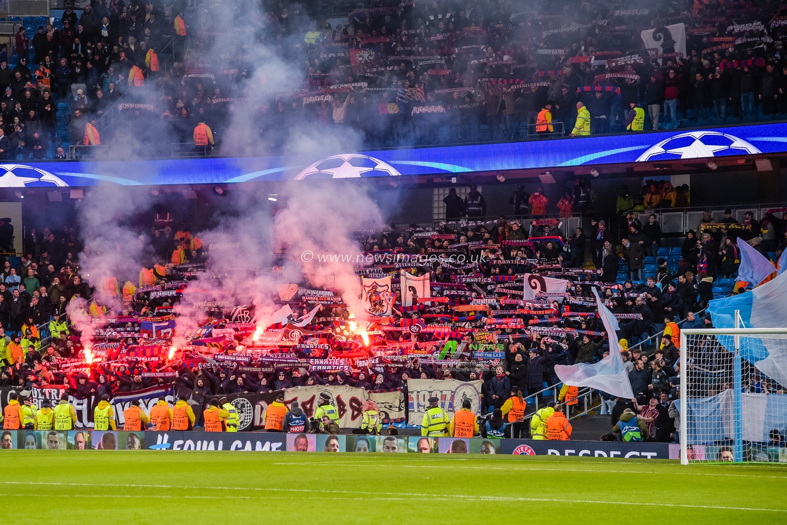 7th March 2018 , Etihad Stadium, Manchester, England; Champions League Round of 16 leg 2, Manchester City versus FC Basel; Basel fans lighting flares as they score to make it 1-1