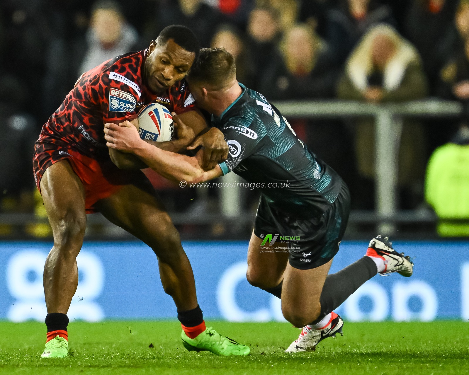 Edwin Ipape of Leigh Leopards is tackled by Adam Milner of Huddersfield Giants during the Betfred Super League Round 1 match Leigh Leopards vs Huddersfield Giants at Leigh Sports Village, Leigh, United Kingdom, 16th February 2024

(Photo by Craig Thomas/News Images)