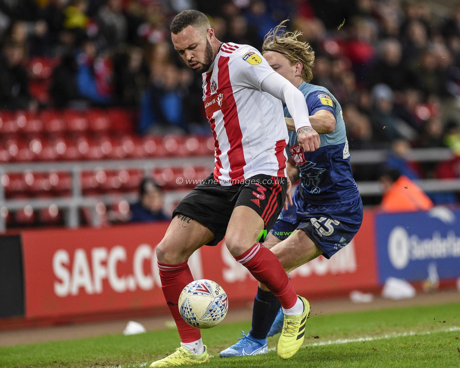 11th January 2020, Stadium Of Light, Sunderland, England; Sky Bet League 1, Sunderland v Wycombe Wanderers : Joel Lynch (3) of Sunderland battles for possession with Alex Samuel (25) of Wycombe Wanderers

Credit: Iam Burn/News Images