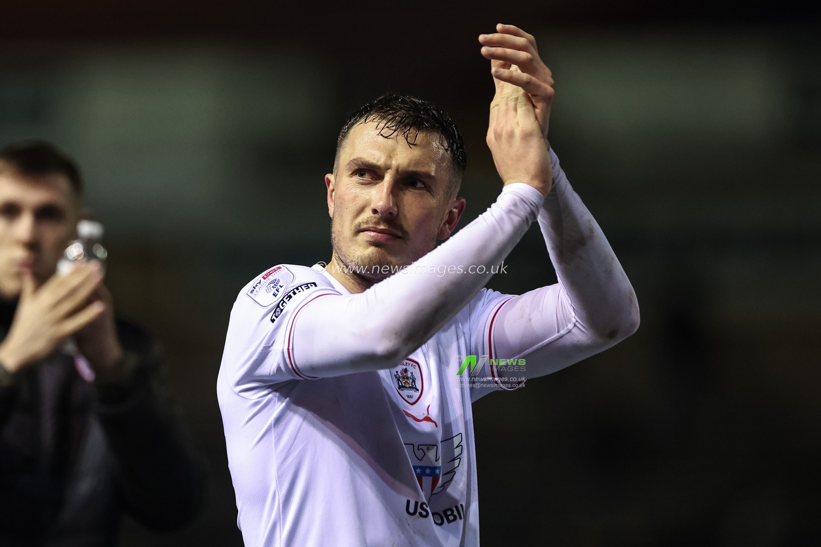 Josh Earl of Barnsley applauds the traveling fans during the Sky Bet League 1 match Carlisle United vs Barnsley at Brunton Park, Carlisle, United Kingdom, 12th March 2024

(Photo by Mark Cosgrove/News Images)