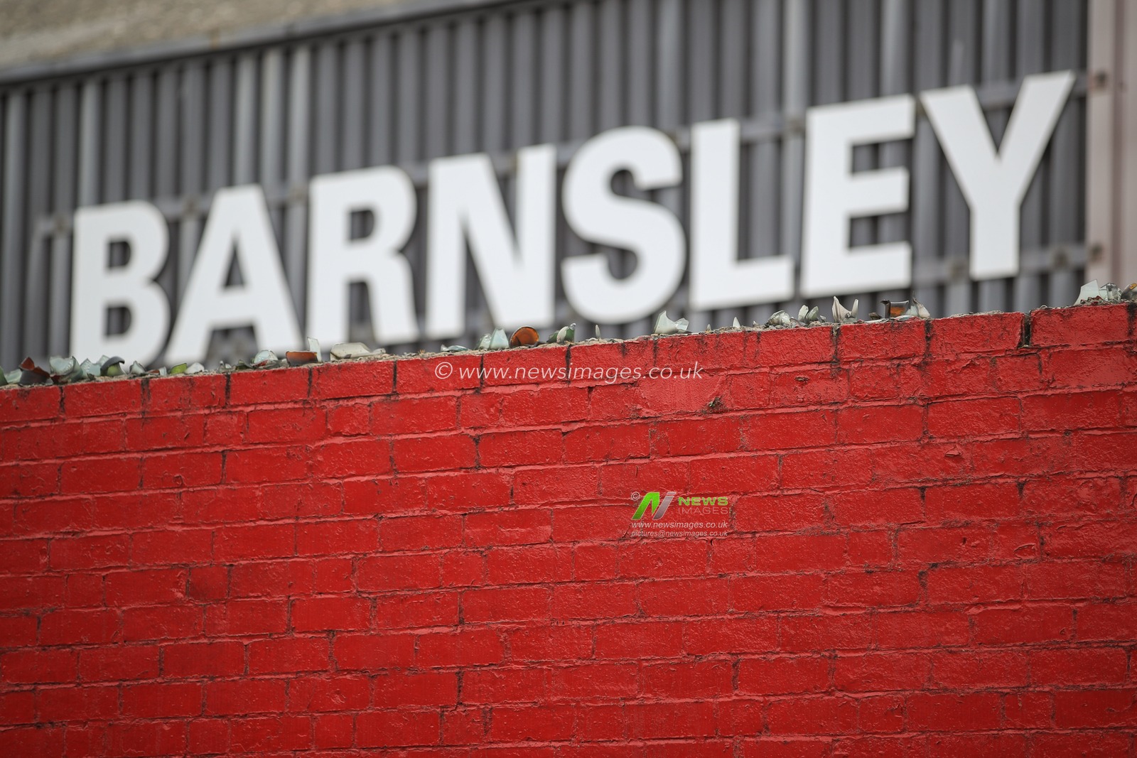 Remnants of a bygone era as glass shards line the top of the West Stand at Oakwell