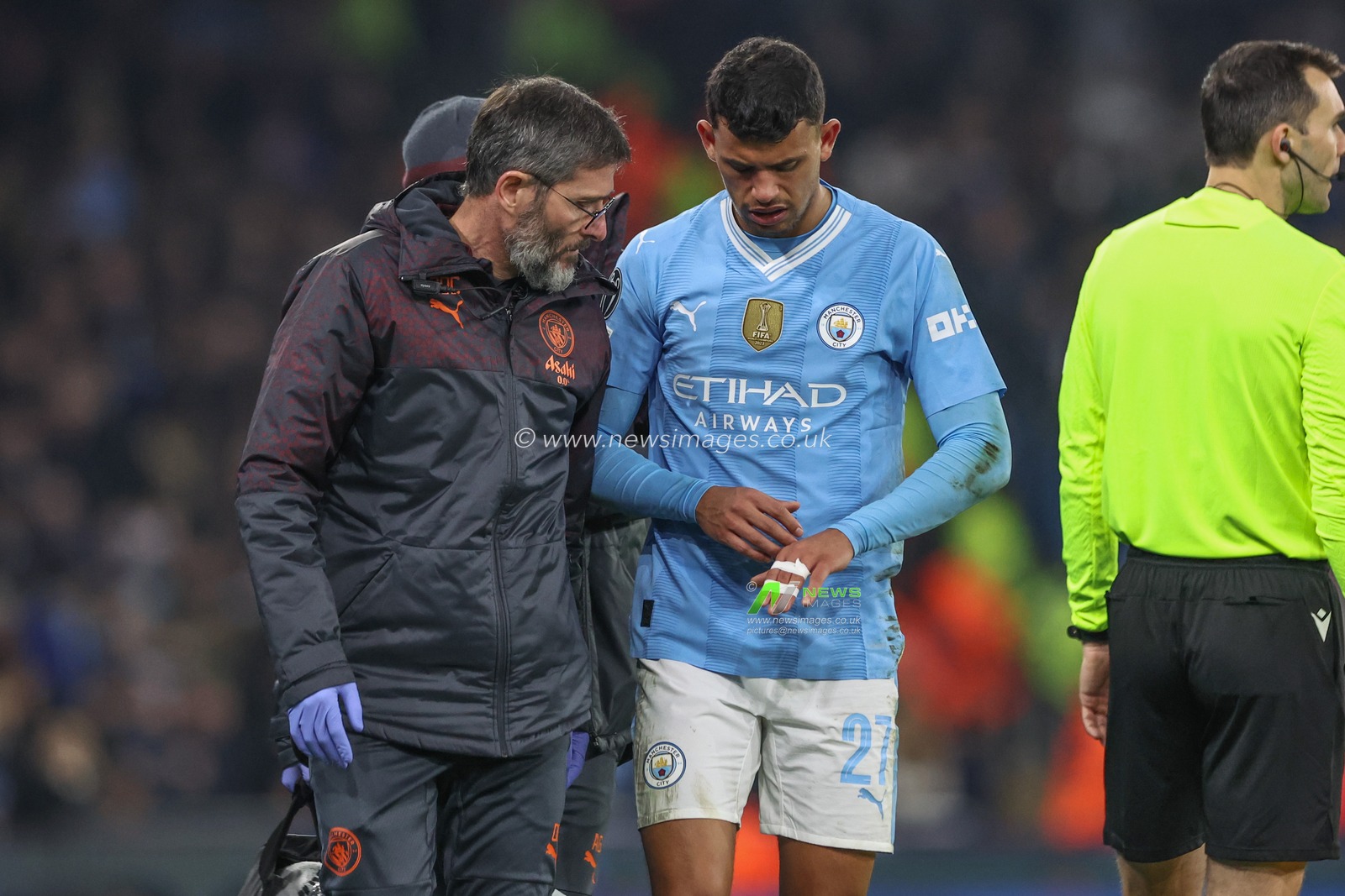 Matheus Nunes of Manchester City comes away from his injury with his fingers taped up during the UEFA Champions League match Manchester City vs F.C. Copenhagen at Etihad Stadium, Manchester, United Kingdom, 6th March 2024

(Photo by Mark Cosgrove/News Images)