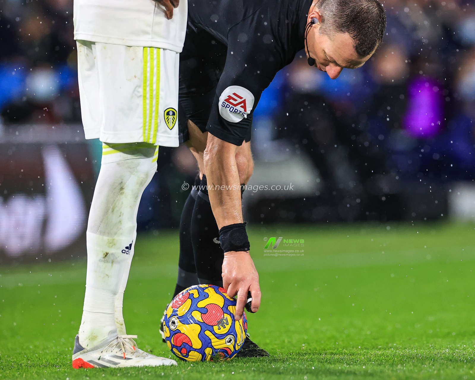 Referee Kevin Friend mark the spot for the free kick
