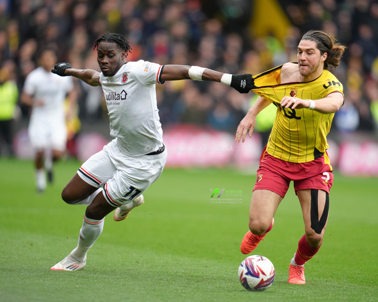 Elijah Adebayo of Luton Town and Francisco Sierralta of Watford battle off the ball during the Sky Bet Championship match Watford vs Luton Town at Vicarage Road, Watford, United Kingdom, 23rd February 2025

(Photo by Harvey Murphy/News Images)