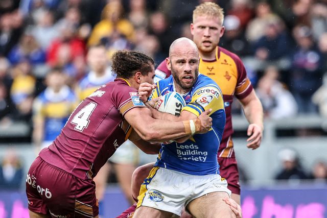 Matt Frawley of Leeds Rhinos is tackled by Ashton Golding of Huddersfield Giants during the Betfred Super League Round 8 match Leeds Rhinos vs Huddersfield Giants at Headingley Stadium, Leeds, United Kingdom, 18th April 2025

(Photo by Alfie Cosgrove/News Images)