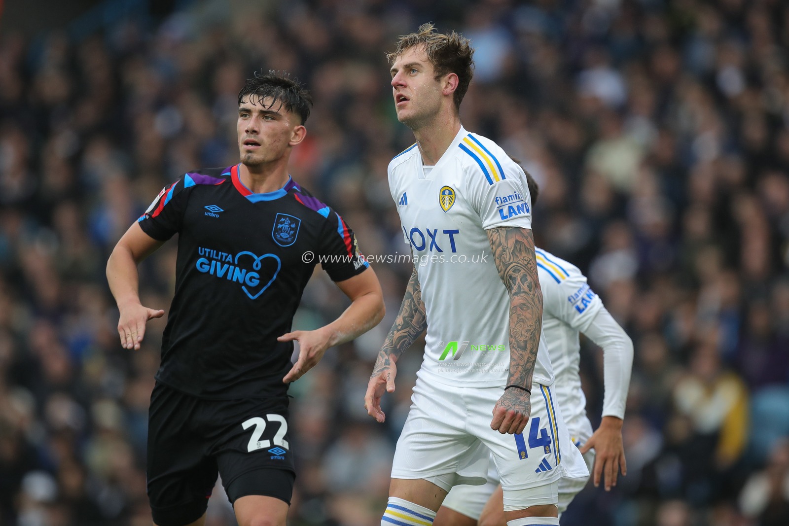 Joe Rodon #14 of Leeds United and Kian Harratt #22 of Huddersfield Town during the Sky Bet Championship match Leeds United vs Huddersfield Town at Elland Road, Leeds, United Kingdom, 28th October 2023

(Photo by James Heaton/News Images)