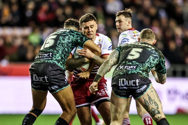 Oliver Partington of Wigan Warriors is tackled by Jacob Alick-Wiencke of Leigh Leopards and Josh Charnley of Leigh Leopards during the Betfred Super League match Wigan Warriors vs Leigh Leopards at The Brick Community Stadium, Wigan, United Kingdom on 26 February 2026

(Photo by Alfie Cosgrove/News Images)
