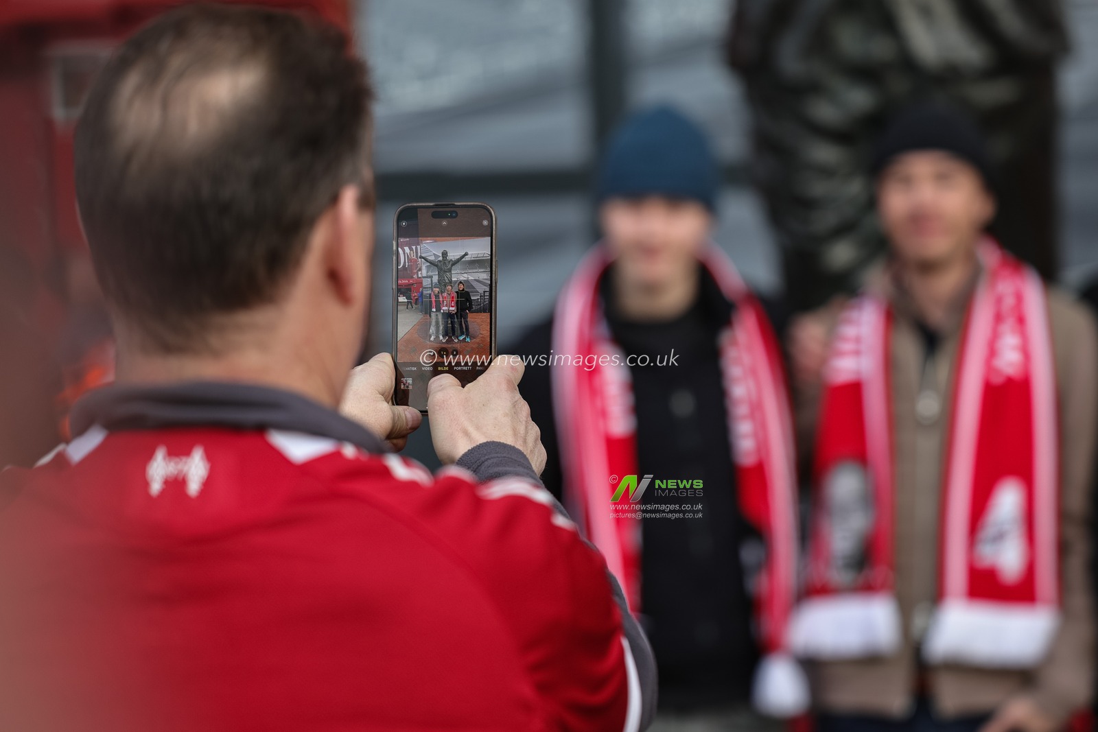 Liverpool fans take a selfie during the Premier League match Liverpool vs Wolverhampton Wanderers at Anfield, Liverpool, United Kingdom, 27th December 2025

(Photo by Mark Cosgrove/News Images)

*** GER AUT SUI OUT ***