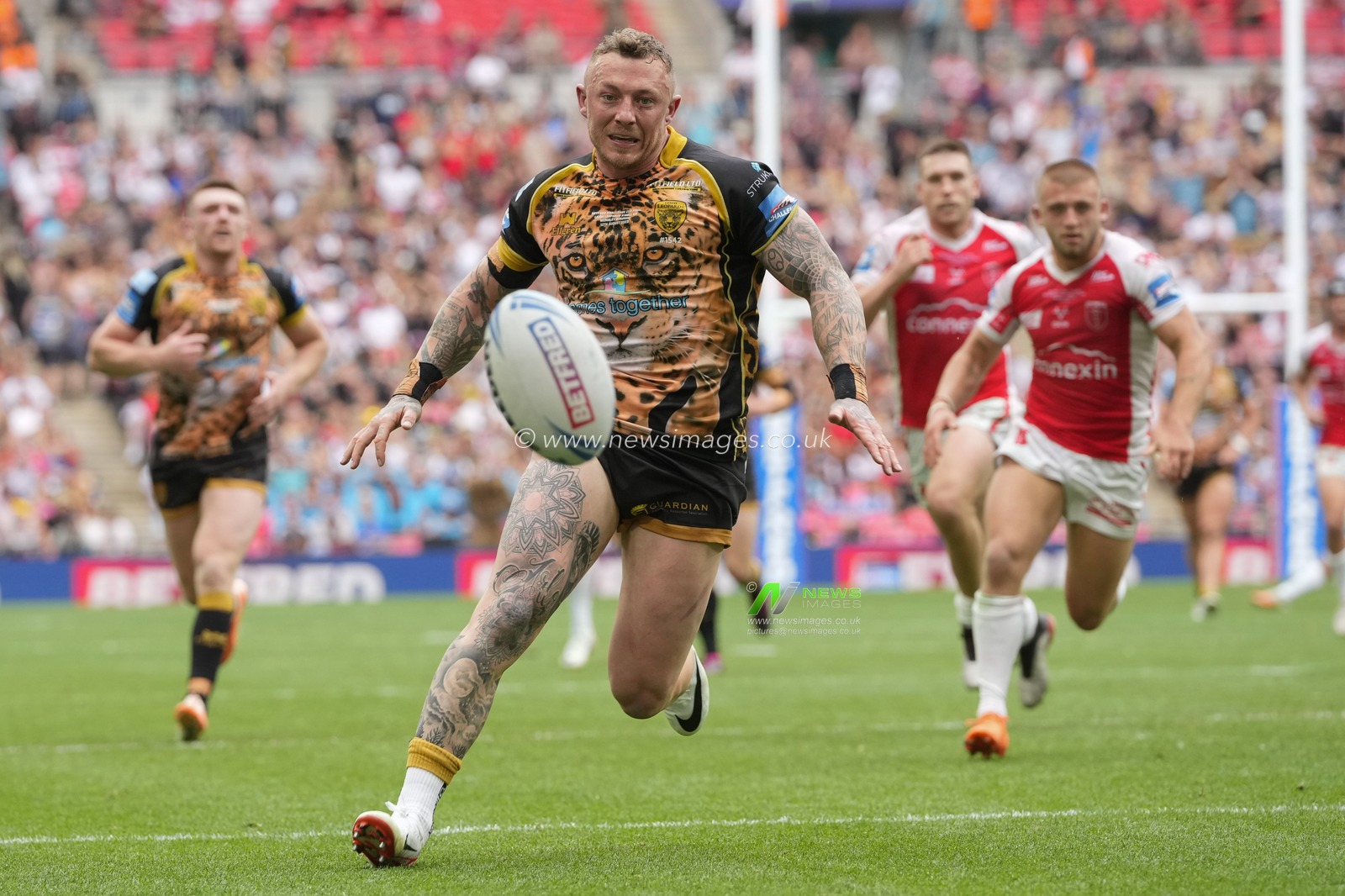 Josh Charnley #5 of Leigh Leopards chases a loose ball during the Betfred Challenge Cup match Hull KR vs Leigh Leopards at Wembley Stadium, London, United Kingdom, 12th August 2023

(Photo by Steve Flynn/News Images)