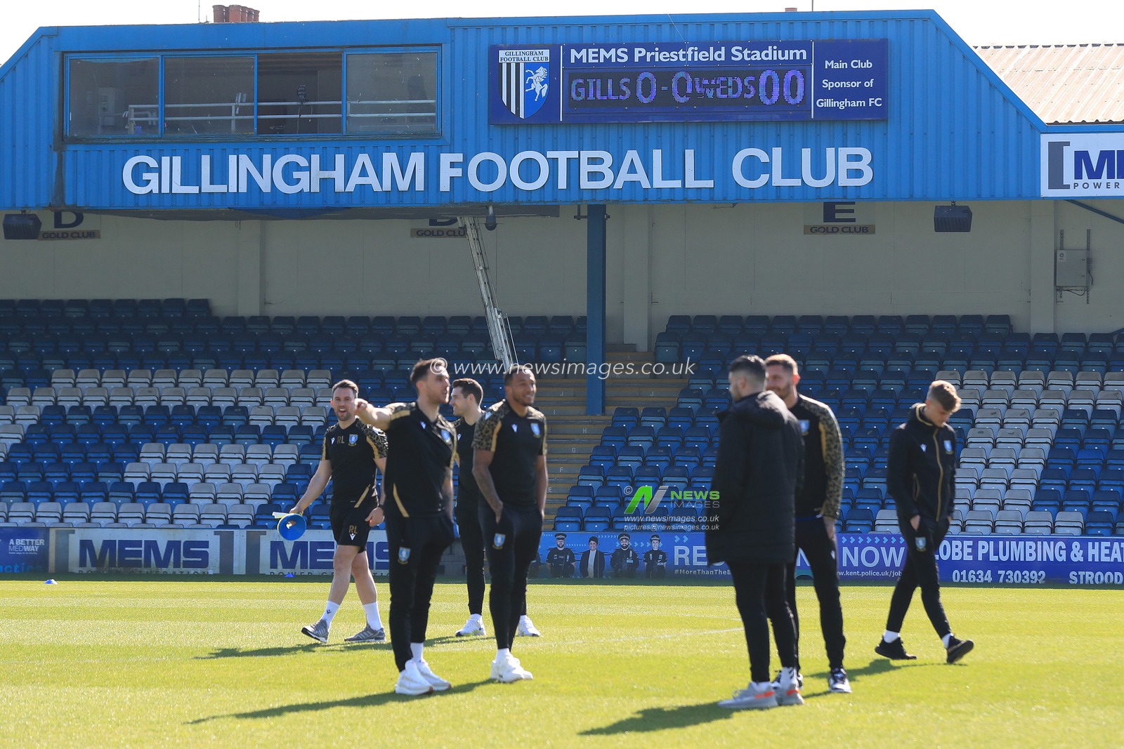 Sheffield Wednesday players survey the pitch.