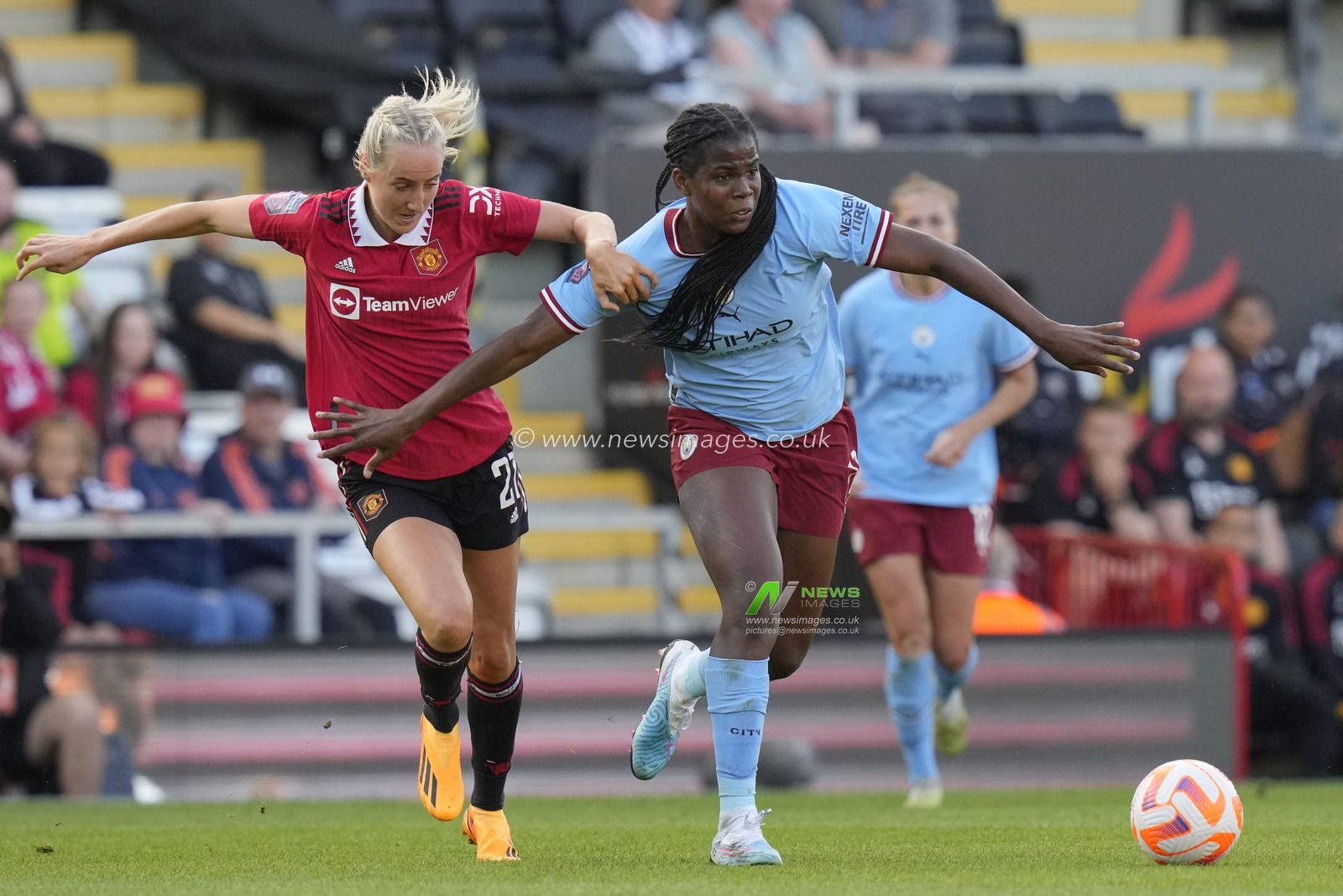 Millie Turner #21 of Manchester United competes for the ball with Khadija Shaw #21 of Manchester City during the The FA Women's Super League match Manchester United Women vs Manchester City Women at Leigh Sports Village, Leigh, United Kingdom, 21st May 2023

(Photo by Steve Flynn/News Images)