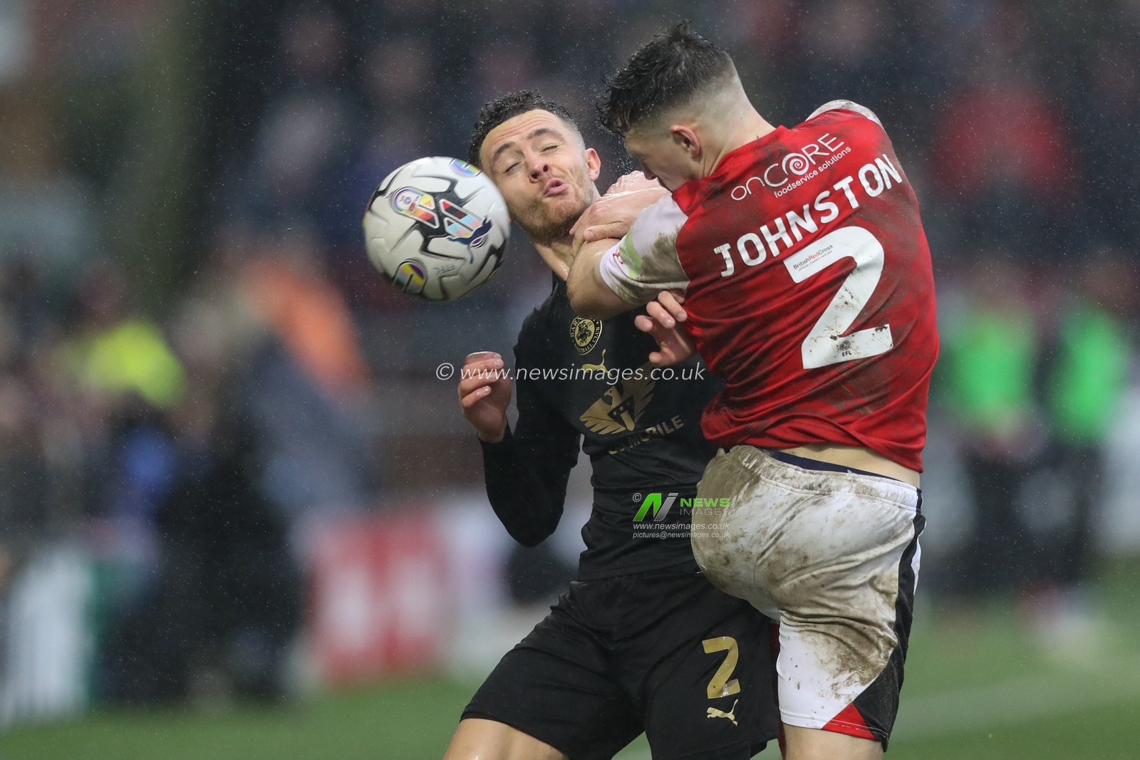 Jordan Williams of Barnsley and Carl Johnston of Fleetwood Town jump up to battle for the ball during the Sky Bet League 1 match Fleetwood Town vs Barnsley at Highbury Stadium, Fleetwood, United Kingdom, 17th February 2024

(Photo by Alfie Cosgrove/News Images)