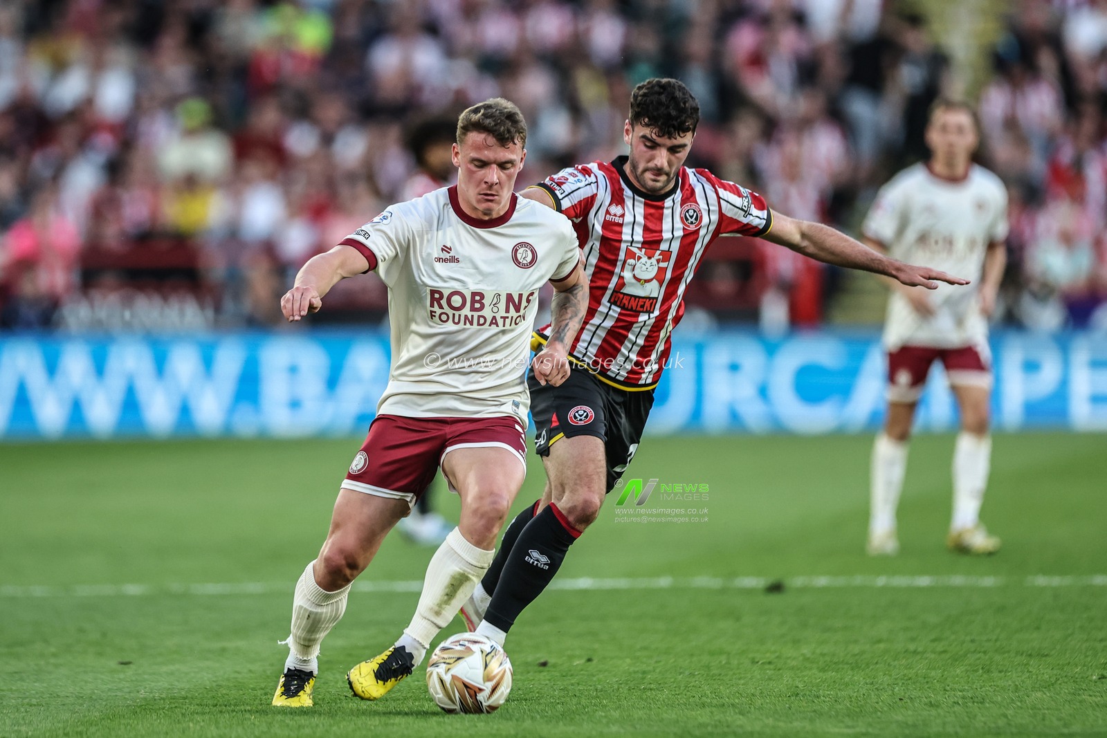 Cameron Pring of Bristol City and Thomas Cannon of Sheffield United battle for the ball during the Sky Bet Championship Playoff Semi-final match Sheffield United vs Bristol City at Bramall Lane, Sheffield, United Kingdom, 12th May 2025

(Photo by Mark Cosgrove/News Images)