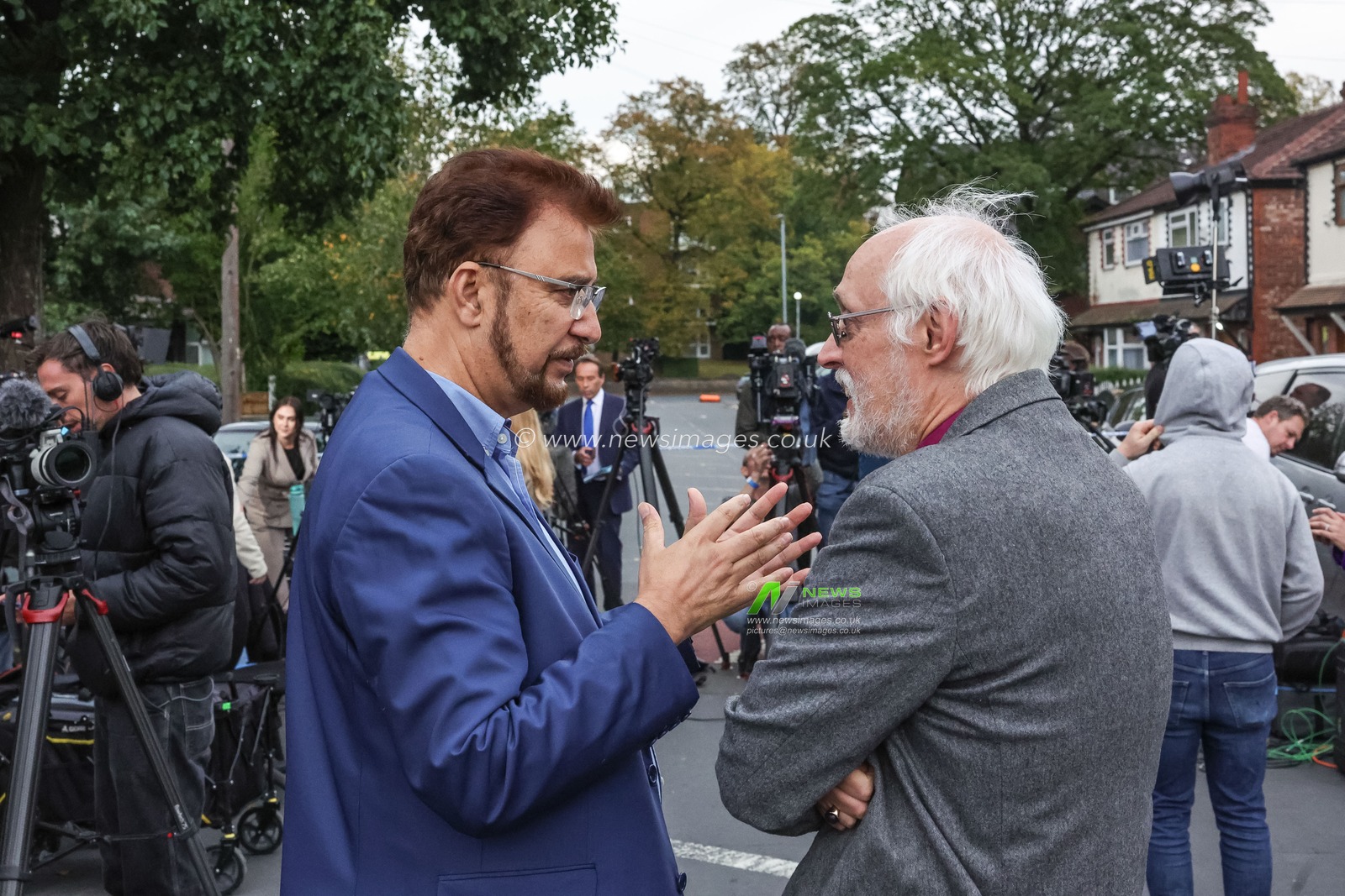 Mohammed Afzal Khan, CBE and Labour MP for Manchester Rusholme speaks with David Walker The Rt. Rev. The Lord Bishop of Manchester TSSF at there police cordon  during the Manchester synagogue attack at Manchester Synagogue, Manchester, United Kingdom, 2nd October 2025

(Photo by Mark Cosgrove/News Images)