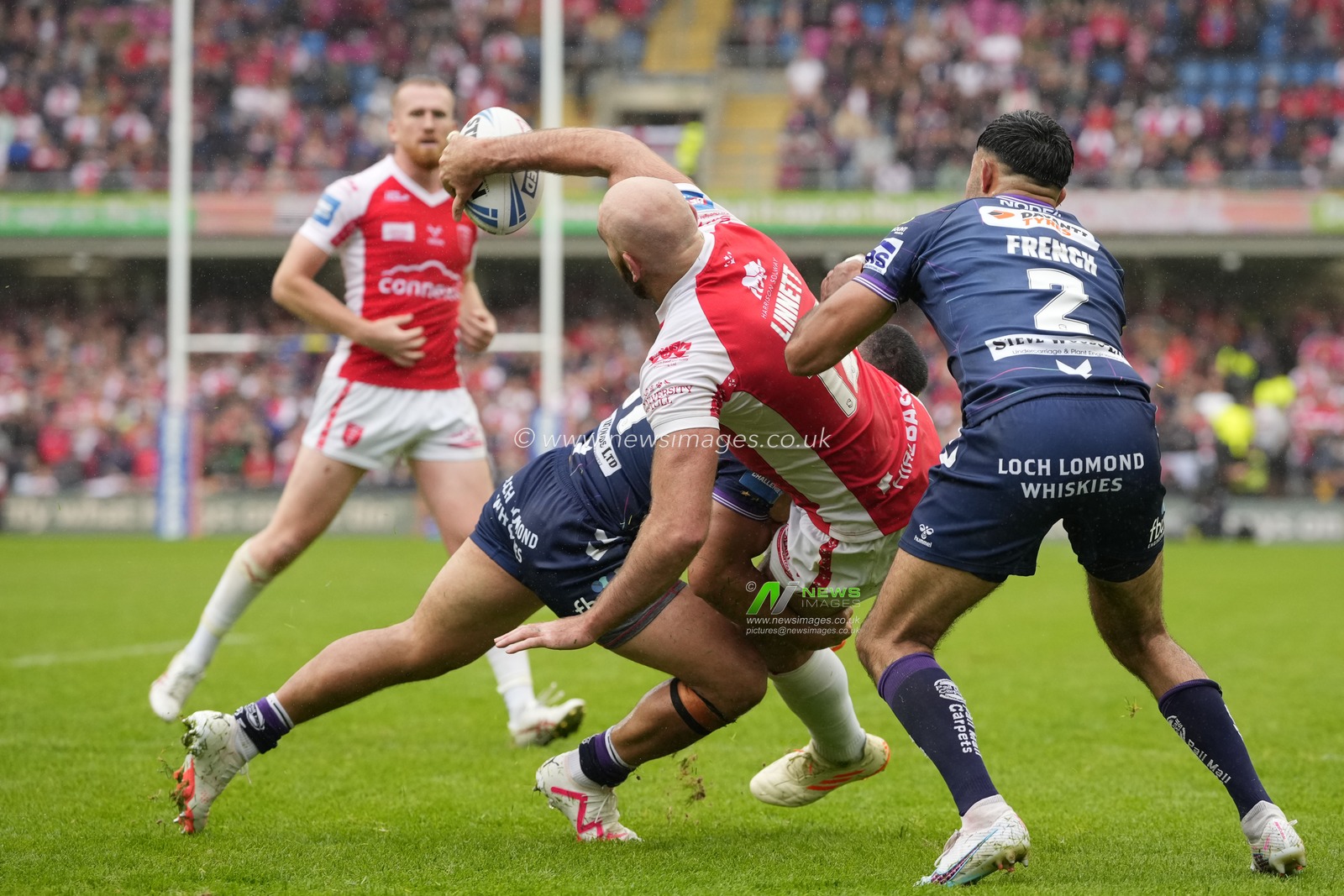 Kane Linnett #12 of Hull KR offloads the ball in the tackle during the Betfred Challenge Cup Semi Final match Hull KR vs Wigan Warriors at Sewell Group Craven Park, Kingston upon Hull, United Kingdom, 23rd July 2023

(Photo by Steve Flynn/News Images)