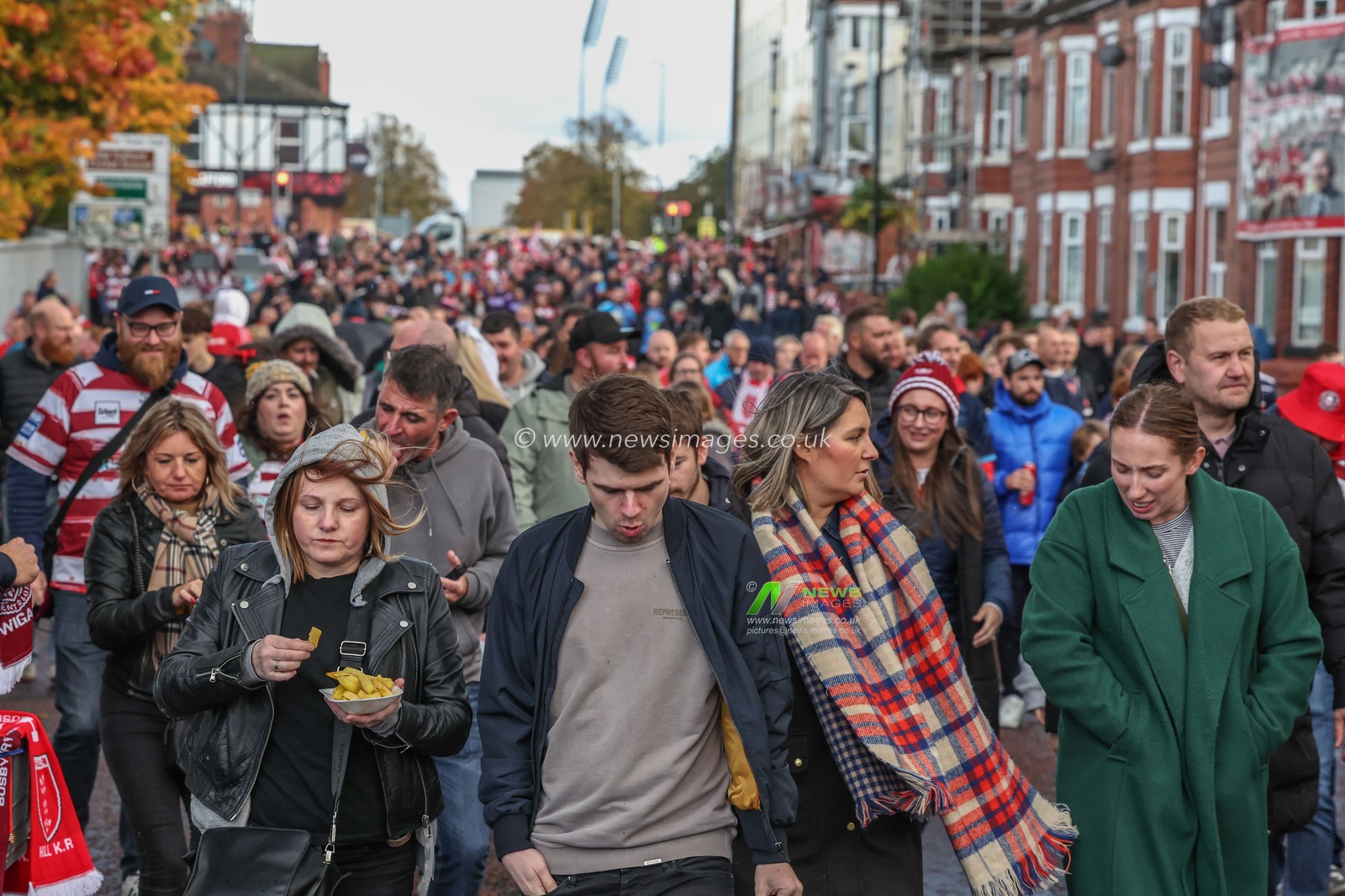 Fans make their way to Old Trafford during the Betfred Super League Grand Final match Wigan Warriors vs Hull KR at Old Trafford, Manchester, United Kingdom, 12th October 2024

(Photo by Mark Cosgrove/News Images)