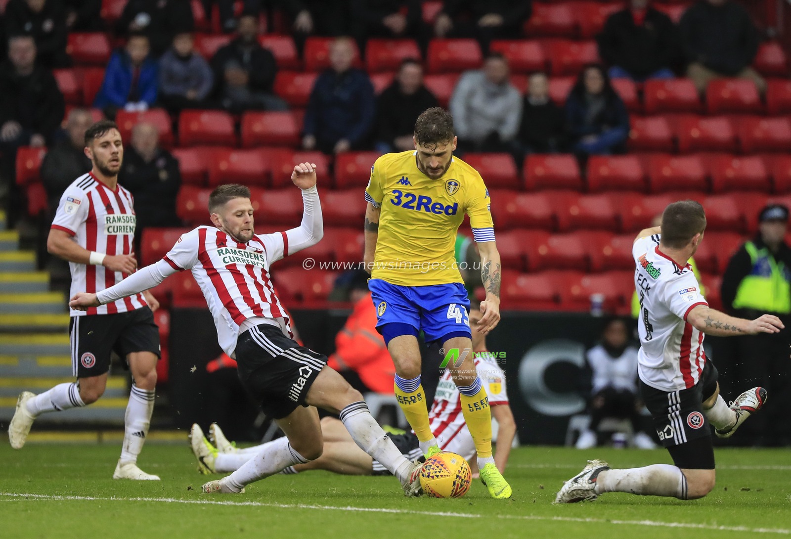 1st December 2018, Bramall Lane, Sheffield, England; Sky Bet Championship, Sheffield United v Leeds United ; Mateusz Klich of Leeds United is challenged by Oliver Norwood (16) of Sheffield United

Credit: Conor Molloy/News Images

English Football League images are subject to DataCo Licence