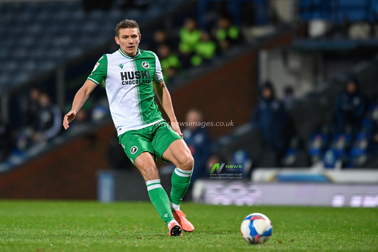 Shaun Hutchinson #4 of Millwall passes the ball