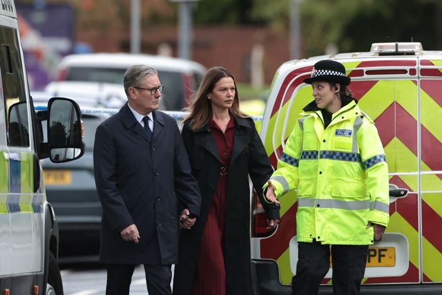 Sir Keir Starmer, Prime Minister of the United Kingdom of Great Britain and Northern Ireland and his wife Victoria, Lady Starmer are escorted by a police officer as the leave the scene during the Manchester synagogue terror attack day 2 at Heaton Park Shul, Manchester, United Kingdom, 3rd October 2025

(Photo by Mark Cosgrove/News Images)