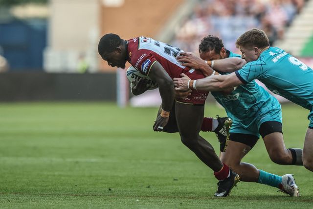 Christian Wade of Wigan Warriors is tackled during the Betfred Super League round 18 match Wigan Warriors vs Huddersfield Giants at The Brick Community Stadium, Wigan, United Kingdom, 11th July 2025

(Photo by Alfie Cosgrove/News Images)