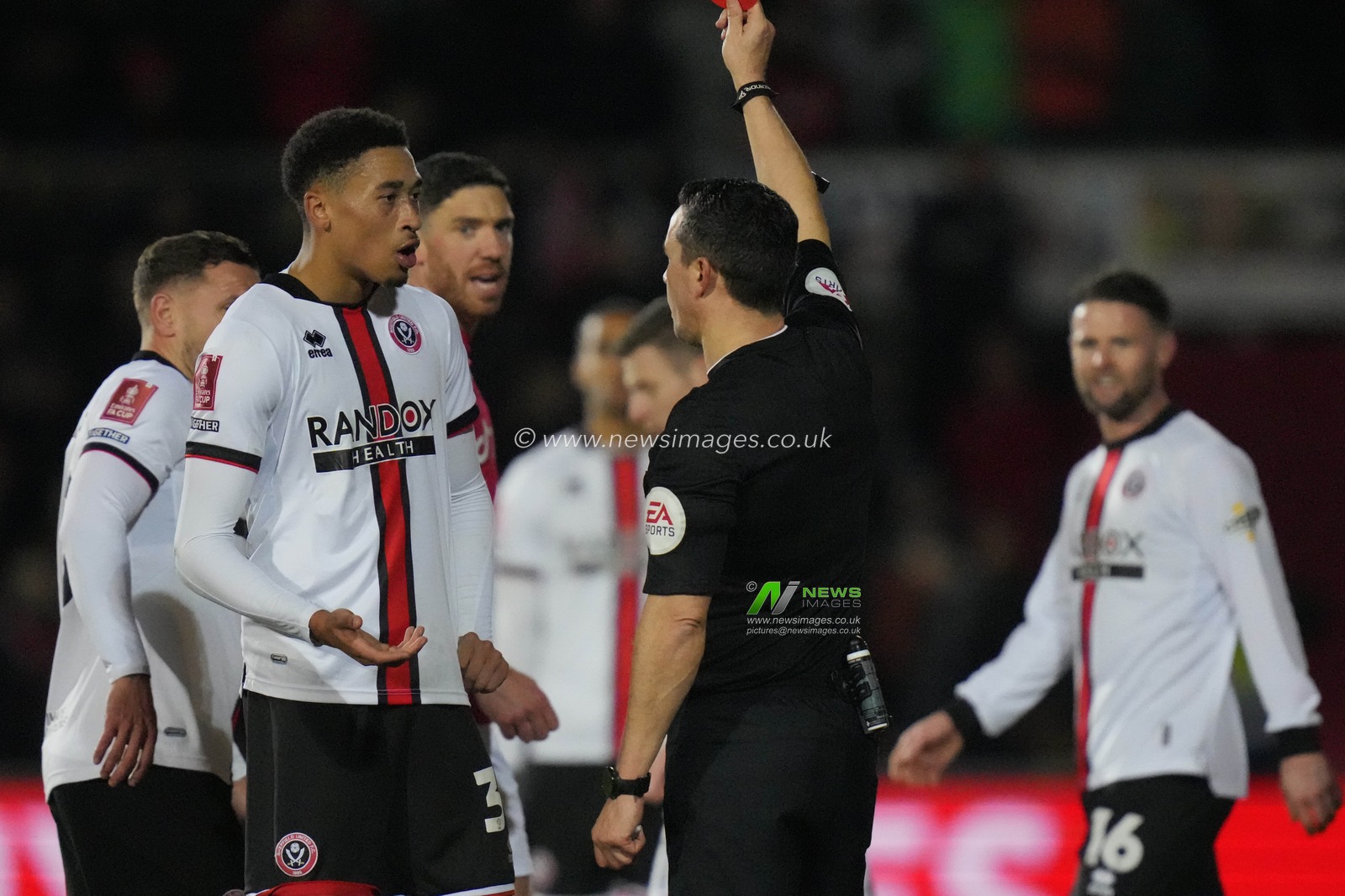 Referee Dean Whitestone shows a red card to Daniel Jebbison #36 of Sheffield United during the Emirates FA Cup fourth round match Wrexham vs Sheffield United at The Racecourse Ground, Wrexham, United Kingdom, 29th January 2023

(Photo by Steve Flynn/News Images)
