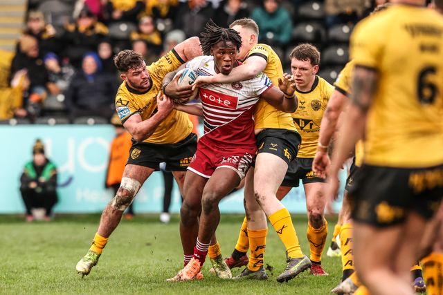 Junior Nsemba of Wigan Warriors is tackled during the Betfred Super League round 1 match Castleford Tigers vs Wigan Warriors at OneBore Stadium, Castleford, Untied Kingdom on 15 February 2026

(Photo by Alfie Cosgrove/News Images)