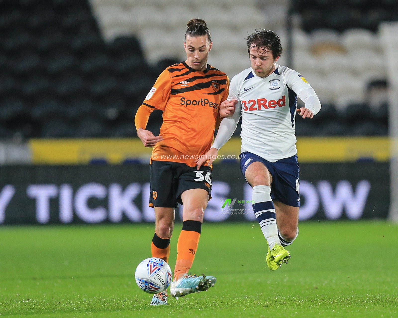 27th November 2019, KC Stadium, Kingston upon Hull, England; Sky Bet Championship, Hull City v Preston North End : Jackson Irvine (36) 0f Hull City and Ben Pearson (4) of Preston North End challenge for the ball

Credit: David Greaves/News Images