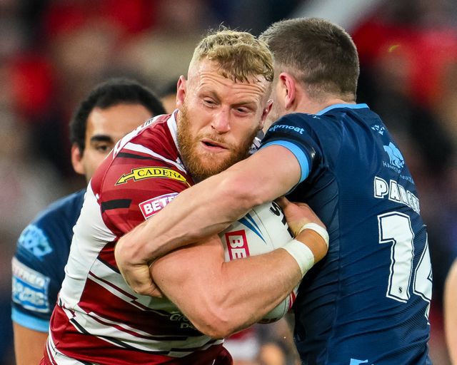 Luke Thompson of Wigan Warriors is tackled by Matt Parcell of Hull KR during the Betfred Super League Grand Final match Wigan Warriors vs Hull KR at Old Trafford, Manchester, United Kingdom, 12th October 2024

(Photo by Craig Thomas/News Images)