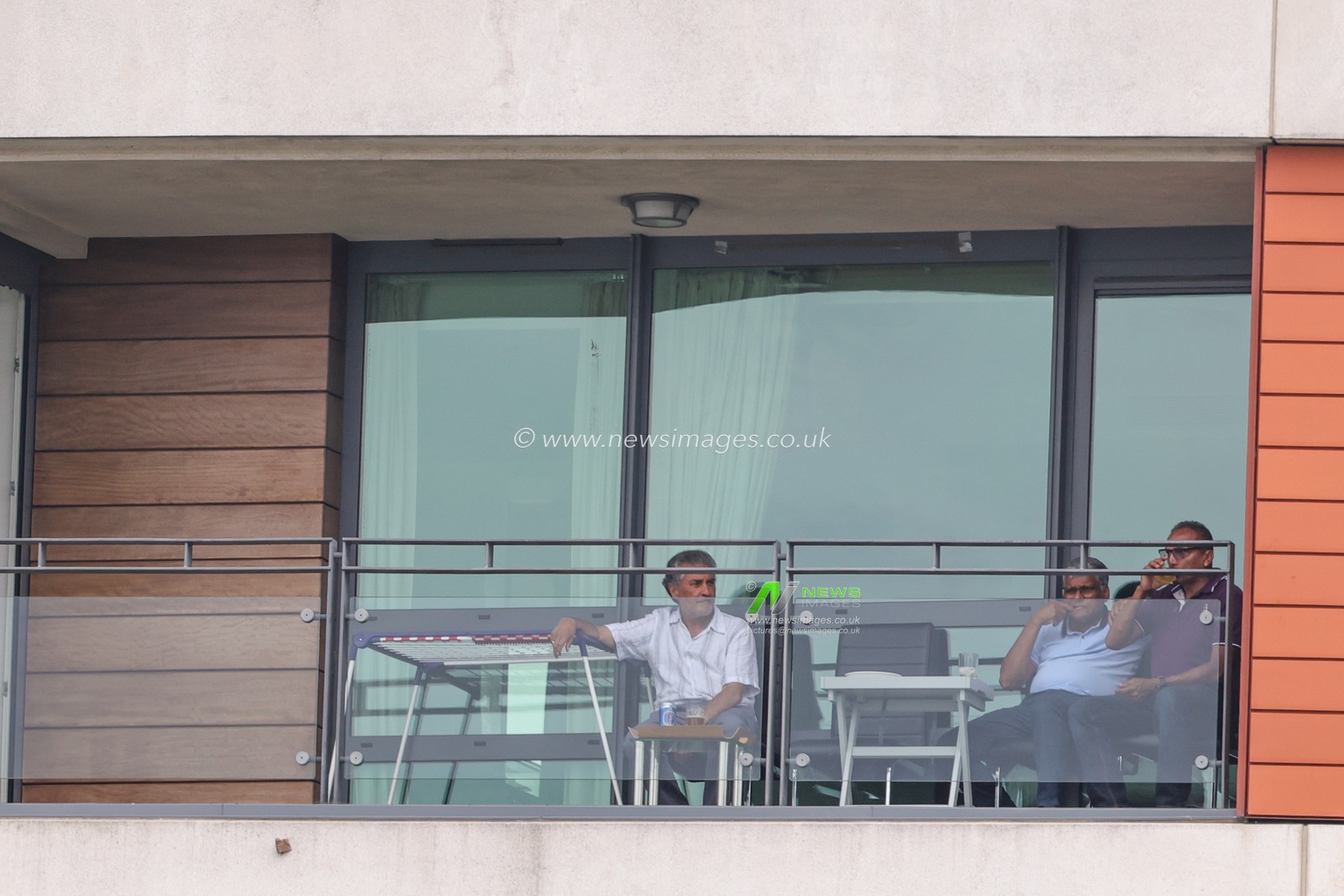 People who live in a nearby block of flats watch the game from the balcony during the LV= Insurance Ashes Test Series Second Test Day 1 England v Australia at Lords, London, United Kingdom, 28th June 2023

(Photo by Mark Cosgrove/News Images)