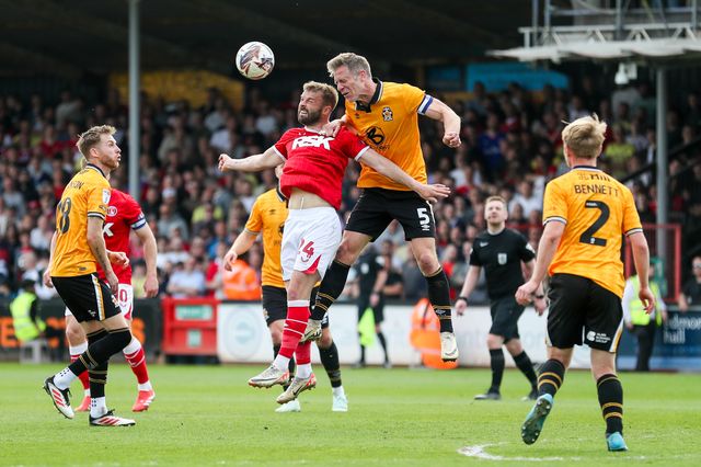 Matty Godden of Charlton Athletic jumps for the ball with Michael Morrison of Cambridge United during the Sky Bet League 1 match Cambridge United vs Charlton Athletic at Cledara Abbey Stadium, Cambridge, United Kingdom, 12th April 2025

(Photo by Izzy Poles/News Images)