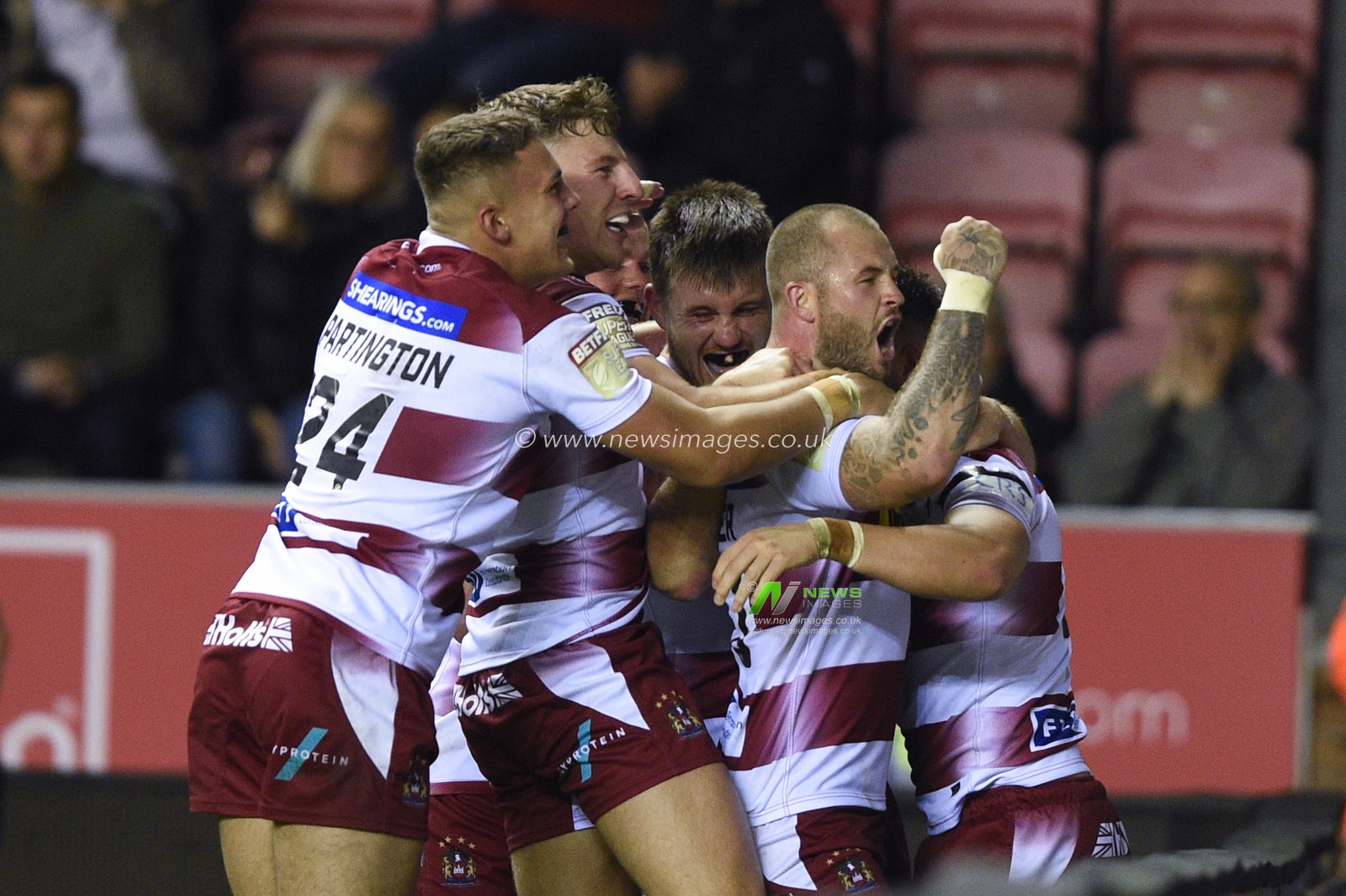 12th September 2019 , DW Stadium, Wigan, England;  Betfred Super League Rugby, Round 29, Wigan Warriors vs Castleford Tigers ; Oliver Gildart (4) of Wigan Warriors celebrates his try with team mate Zak Hardaker (20) of Wigan Warriors 

Credit: Richard Long/News Images