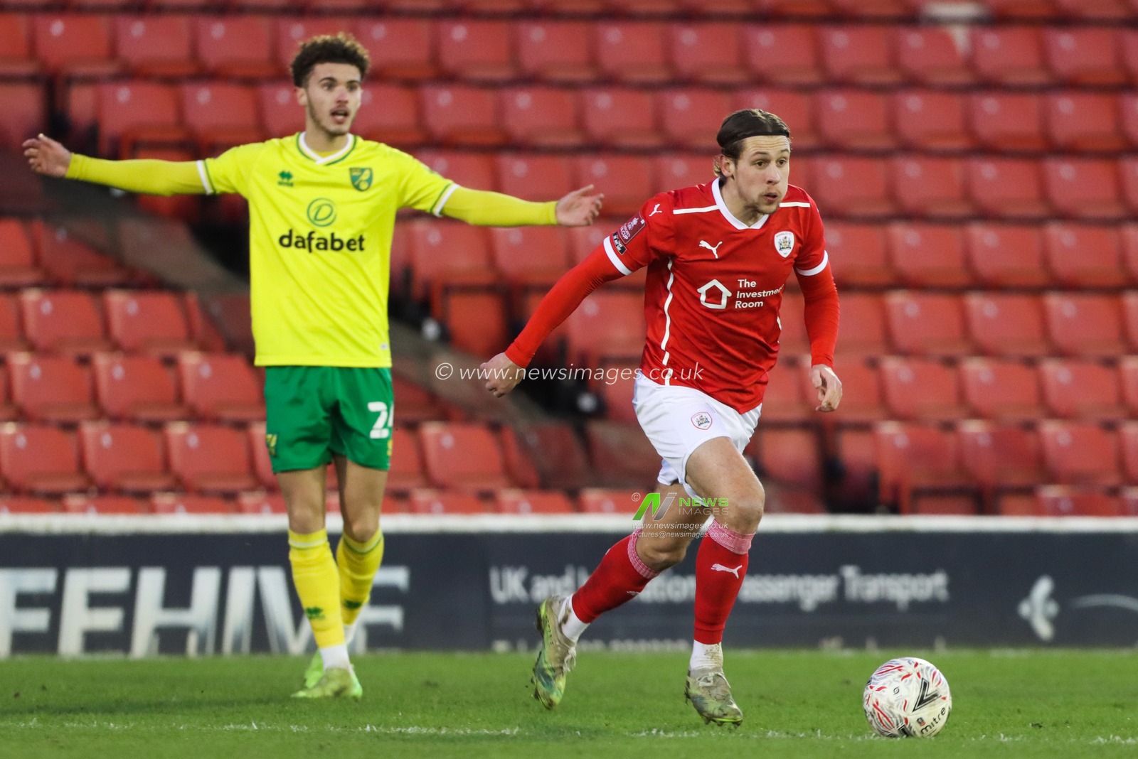 Callum Brittain #7 of Barnsley runs away with the ball